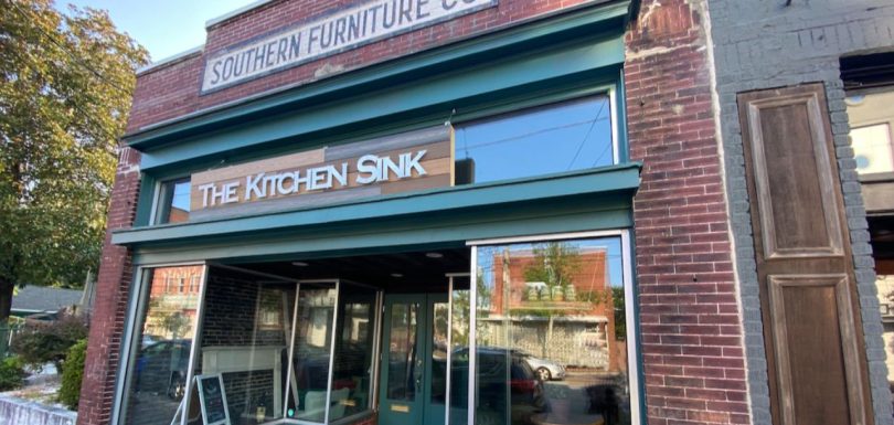 The Kitchen Sink storefront in a historic brick building in Wilmington, NC
