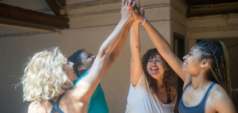 Group of women celebrating together after a fitness activity
