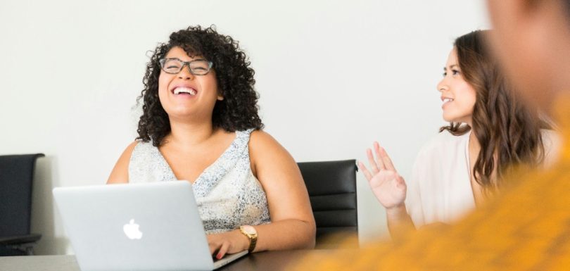 Women talking and laughing together during a group discussion